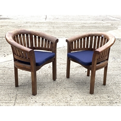 Pair teak garden armchairs, curved backs and serpentine slatted seats, with seat cushions, W84cm
