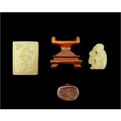 Chinese jade tablet with incised bird, cat etc 5cm x 3.5cm and a carved jade group of two monkeys H4cm