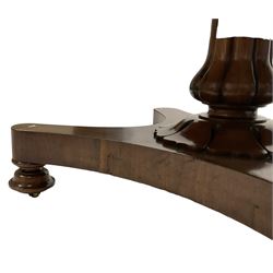 19th century mahogany rectangular drop-leaf table, shaped and moulded frieze rail, raised on reeded vasiform pedestal with floral collar, the quadriform base terminating in turned feet on castors