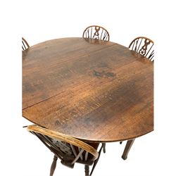 18th century oak drop leaf dining table, the oval drop leaf top over gate leg action, raised on square splayed supports (W150cm, D175cm, H74cm) together with well matched set of six elm and beech Windsor dining chairs, the wheeled back over pierced splat and saddle seat, raised on turned supports united by a stretcher (W40cm)