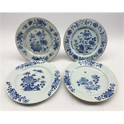 Two 18th century Delft tin-glazed plates with similar floral design and brown rims, D22cm, together with another pair of 18th century Delft tin-glazed plates (4)