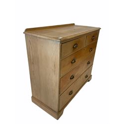Late Victorian pine chest fitted with two short and three long graduated drawers, raised on shaped plinth base W107cm H97cm, D47cm
