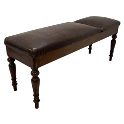Victorian mahogany physician's examination table or medical couch, the adjustable headrest and sprung seat upholstered in chocolate brown leather, raised on turned and tapering lappet carved supports 