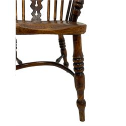 19th century yew wood and elm Windsor chair, low hoop stick back with pierced ad figured splat, dished seat raised on ring turned supports joined by crinoline stretcher
