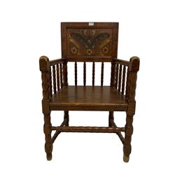 19th century scumbled pine Swedish armchair, the panelled back painted with traditional patterns over bobbin turned spindles, raised on turned supports united by stretchers