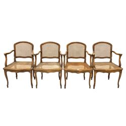 Set of four French beech bergere chairs, shield back and seat with cane panels, swept open arms, raised on cabriole supports W55cm