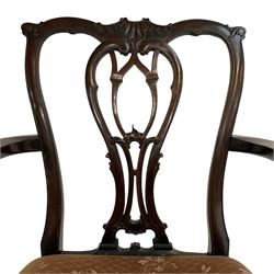 George III mahogany elbow chair, shaped shell carved cresting rail over open pierced splat carved with foliage, shaped arms with acanthus carved terminals, upholstered seat with stud band and gadroon moulded edge, on acanthus and scroll carved cabriole legs with ball and claw feet 