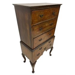 Early 20th century Queen Anne design walnut chest-on-stand, moulded rectangular top over three drawers, the stand fitted with one long drawer and three small drawers, each drawer inlaid with feather banding and fitted with shaped handle plates, shaped apron on cabriole supports