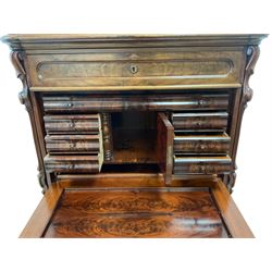 19th century Biedermeier figured mahogany secretaire cabinet, raised serpentine single drawer, frieze drawer over panelled fall front, the interior fitted with a combination of small drawers, cupboard and writing slide, three long drawers below, the uprights with carved scroll decoration 