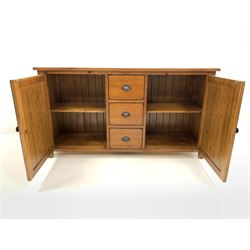 Late 20th century cherry sideboard, fitted with three drawers to centre, flanked by two panelled cupboards, each enclosing a shelf, raised on stile supports W158cm, H86cm, D45cm