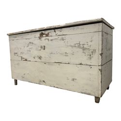 Late 19th century painted pine chest or coffer, rectangular hinged top over deep compartment, raised on stile supports, in white finish