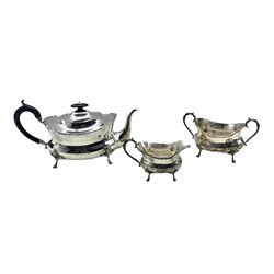Edwardian silver three piece tea set of oblong form engraved with monogram, the tea pot with ebonised handle and lift on paw feet Sheffield 1908 Maker James Deakin & Sons 32oz gross