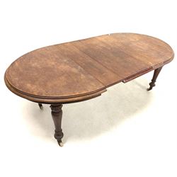 Victorian mahogany wind out extending dining table, the oval top with moulded edge, raised on turned supports with brass and ceramic castors, three additional leaves 225cm x 111cm, H77cm (extended)