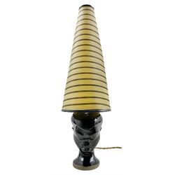 1960s Dartmouth Pottery table lamp in the form of a female head with conical striped shade, H58cm overall