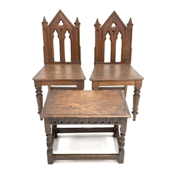 Pair of Victorian oak hall chairs of Gothic design, (W44cm) together with an 18th century style oak foot stool, (W56cm)