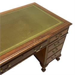 Early 20th century Georgian design stained beech twin pedestal desk, rectangular top with inset green leather writing surface, fitted with nine drawers, on ball and claw feet