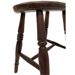 19th century elm and beech stool, oval seat on four turned supports joined by swell turned stretchers (H49cm); and a similar smaller stool (H45cm)