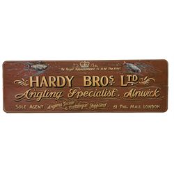 Hand painted shop sign advertising Hardy Bros Ltd By Royal Appointment to H.M. The King, Angling Specialists Alnwick, England - Anglers Guide & Catalogue Supplied Sole Agents 61 Pall Mall, London' 53cm x 167cm