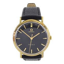 Omega Genève 9ct gold gentleman's manual wind wristwatch, ref. 188, movement No. 28101843, black enamel dial on black leather strap, boxed with papers and service papers