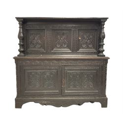 19th century and later oak court cupboard, the rectangular top over two cupboard doors flanked by two turned pillars over two large cupboards  profusely carved with lunettes and foliate design W135cm, H129cm, D57cm 