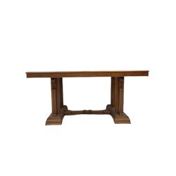 Early 20th century oak dining table, raised on four scrolled supports, united by a stretcher W161cm, H75cm, D100cm 