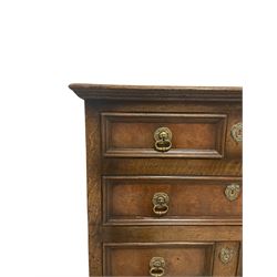 18th century design oak chest on chest, fitted with two short and five long panelled oak lined drawers, raised on lobed supports 