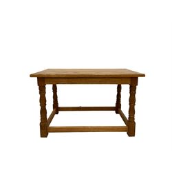 Light oak coffee table, raised on turned and squared supports with animal carving 
