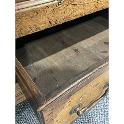 18th century oak mule chest, the lifting top opening to reveal three small drawers and cupboard, over two drawers, raised on bracket supports W125cm, H90cm, D53cm 
