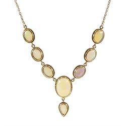 9ct gold oval opal necklace, seven gold mounted cabochon oval opals, with a pendant pear shaped opal, hallmarked 