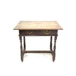 18th century oak side table, rectangular panelled top with moulded edge over two drawers with brass drop handles, turned and block supports united by stretcher, 79cm x 56cm, H70cm