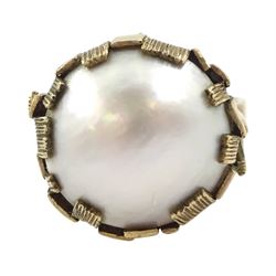 9ct gold mabe pearl ring, in a textured claw setting, hallmarked