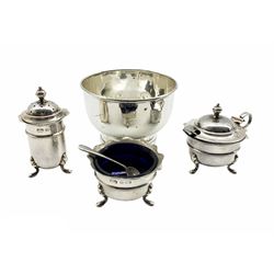Silver three piece circular condiment set with crimped rims and blue glass liners London 1932 Maker Manoah Rhodes & Sons, two silver salt spoons and a silver circular bowl D10cm  7oz 