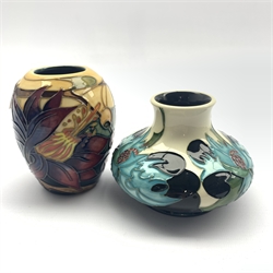  Moorcroft Harting pattern vase designed by Emma Bossons, H10cm and another decorated in the Sea Holly pattern (2)  