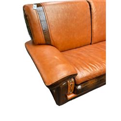 Formitalia - two seat sofa upholstered in orange leather with crocodile skin design patent trimming, padded arm rests above gilt buckle uprights, on block feet