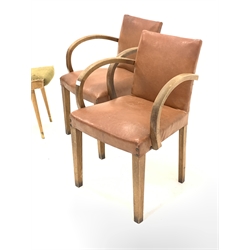 Pair of French 1930s Art Deco open armchairs, with bentwood arm rests, faux leather upholstered seat and back panels, raised on square tapered supports, (W55cm) together with a pair of upholstered footstools, raised on turned tapered supports, (W61cm)