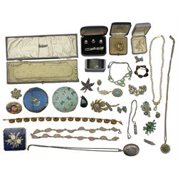 Group of jewellery including citrine brooch, large silver locket pendant on chain, silver ingot pendant on chain, micro mosaic brooch, and various items of costume jewellery, including paste set necklaces, brooches, two compacts and a silver napkin ring