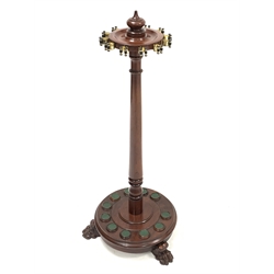 Victorian mahogany cue stand or rack, fitted to hold twelve cues, raised on three carved paw supports 