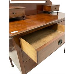 Early 20th century mahogany dressing chest, raised shaped swing mirror with two trinket drawers, fitted with two short and two long drawers, on square tapering supports with castors