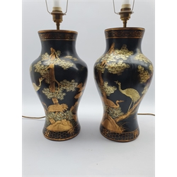 Pair of Black lacquer Chinoiserie table lamps of baluster form, decorated with scenes of deer and crane in a landscape, H45cm 