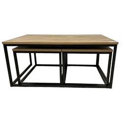 Nest of three contemporary tables, on black finish metal bases