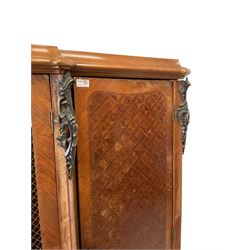 Mid-to late 20th century French Kingwood armoire cabinet, break-front with moulded top, decorated with parquetry work, the central door with grille over shaped panel, two flanking doors, with trailing foliage and cartouche cast metal mounts, shaped apron with shell mount, on cabriole feet mounted by trailing foliage castings with scrolled terminals