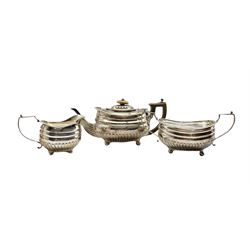 George III silver three piece tea set of oval design with half body reeded decoration, gadrooned border, engraved with a monogram and on ball feet London  1812 makers mark rubbed 35oz 
