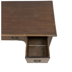 Early 19th century mahogany kneehole desk, raised on square tapering supports 