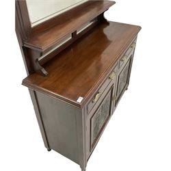 Edwardian walnut mirror backed chest, the mirror back over two drawers and two cupboards, raised on turned supports 