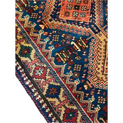 Persian Hamadan blue ground runner, nine interconnected lozenge medallions surrounded by small stylised floral motifs, the guarded border decorated with linked and trailing geometric pattern