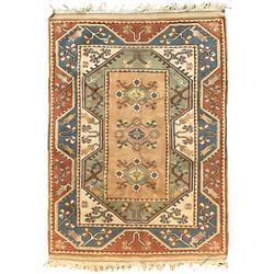 Turkish Milas rug, peach central field with three lozenges with flower heads, the extending borders with geometric foliate designs and stylised plant motifs (144cm x 199cm); and antique Turkish red ground rug, decorated with boteh motifs and stylised flower heads (166cm x 128cm)