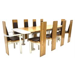 Eero Aarnio - A 1960's 'Viking' dining suite, comprising a varnished pine and white lacquer extending dining table, the single additional leaf under the table when not in use, raised on cylindrical supports with disk feet (L213cm/268cm, D96cm, H74cm) and a set of ten (8+2) dining chairs, with brown vinyl upholstered back and seats, (W57cm/45cm) 