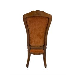 19th century walnut lady's salon chair, shaped and moulded frame with floral carved cresting, over-stuffed serpentine seat and buttoned back, scrolled cabriole supports carved with flower heads