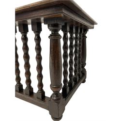 Late 19th century oak fire fender, the moulded rectangular top on a balustrade of bobbin turned supports, moulded lower rail, on turned feet
