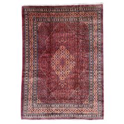 Fine Persian Bijar rug, red ground with central medallion, the field decorated with herati motifs, multi-band border with repeating design